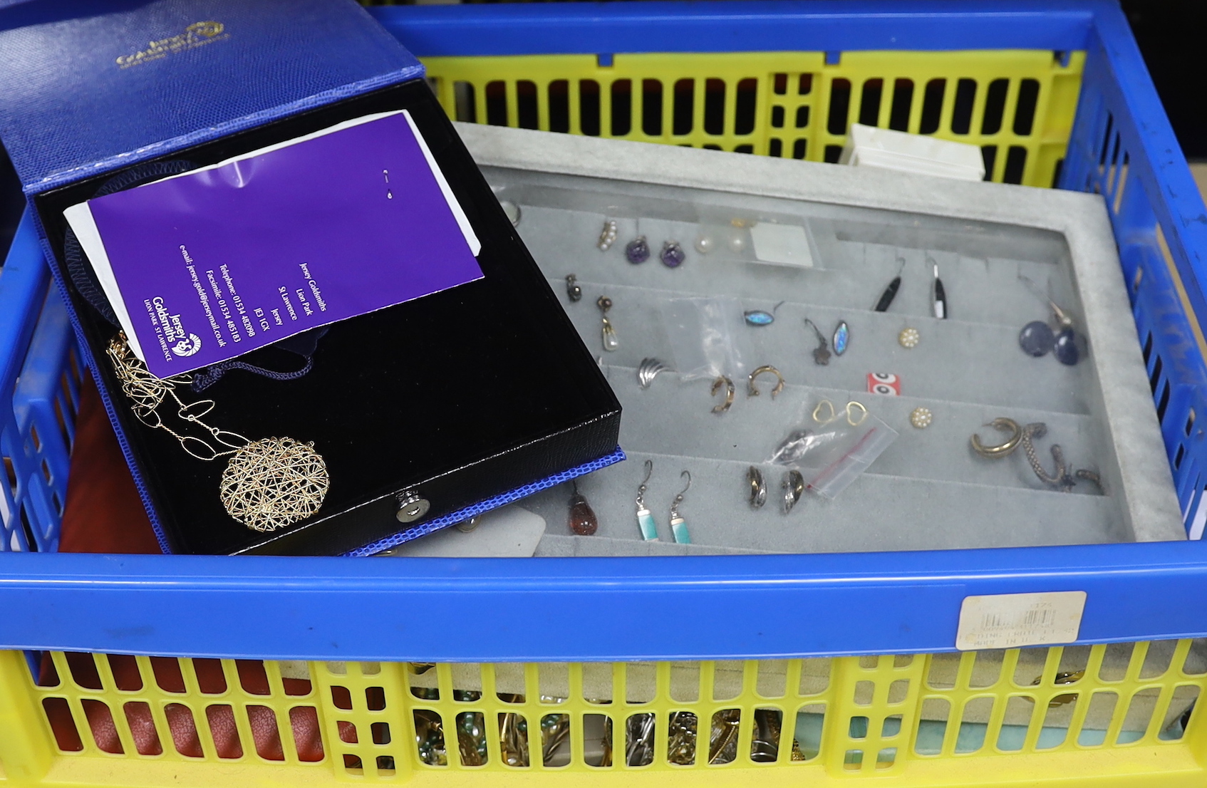 Costume jewellery including a case of earrings.